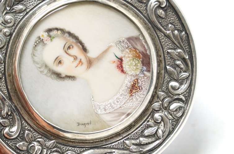 An early 20th century continental white metal circular snuff box, the cover with inset miniature watercolour of a lady signed Drepize?, 58mm. Condition - fair to good